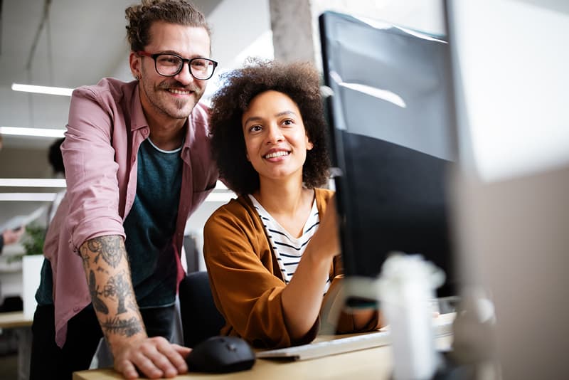 image of two people working on a project together