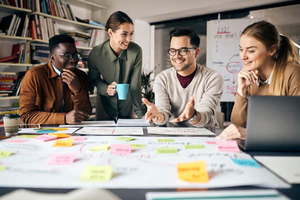 image of a small group of people working on a project together